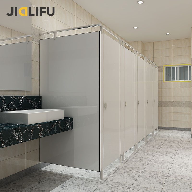 Why American bathroom stalls have such large gaps? 3 american bathroom stalls